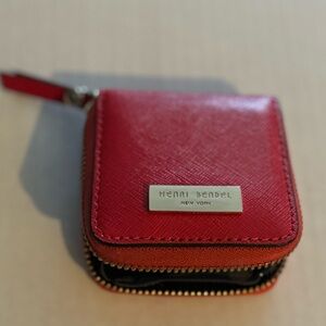 Henri Bendel, New York eye contact carrying zippered case. Red with tassel pull.